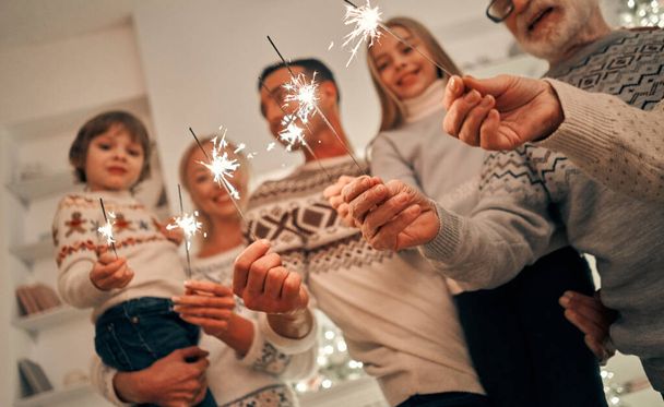 The happy family with bright sparklers - Zdjęcie, obraz