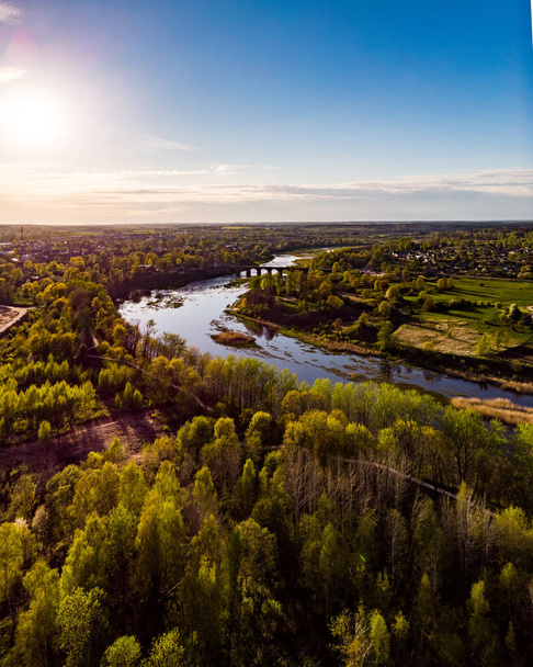 Areal countryside view from drone with small river Venta. Photo taken in Europe. - Photo, Image