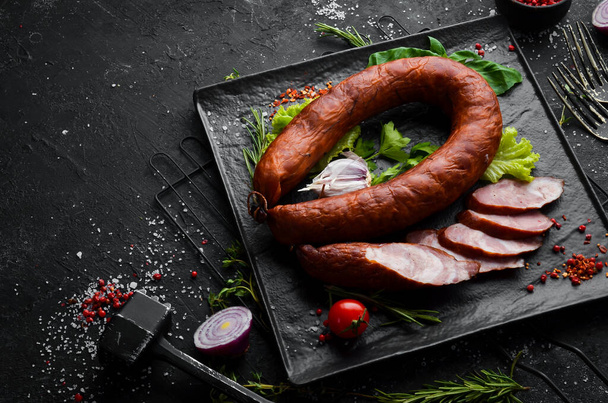 Smoked salami with garlic, spices and herbs. Top view. Free space for text. - Valokuva, kuva