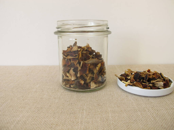 Dried mushrooms in a glass, bay bolete and porcino - Photo, Image