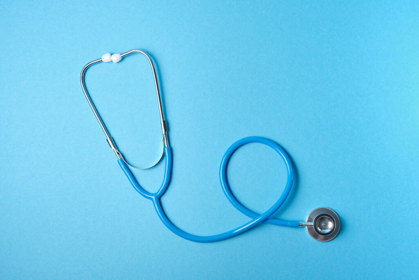 medical stethoscope on blue background, copy place, phonendoscope for diagnosing diseases - Фото, зображення