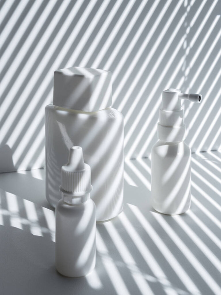 Minimalist composition with blank vials on a white background and striped shadow - Fotografie, Obrázek