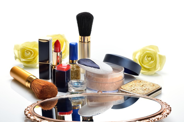 Items for decorative cosmetics, makeup, mirror and flowers - Photo, Image