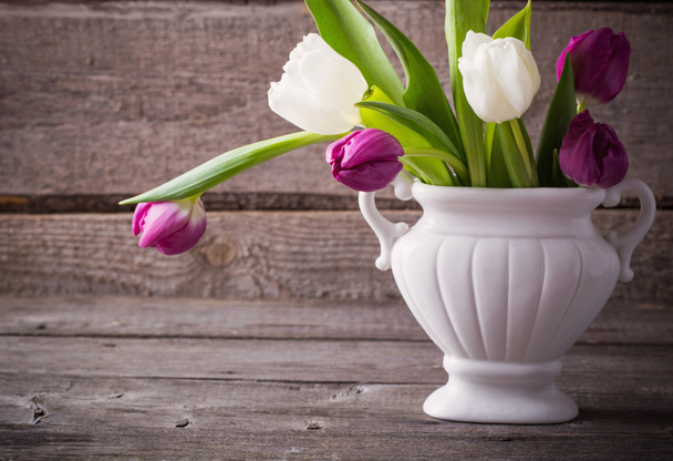 tulips on wooden background - 写真・画像