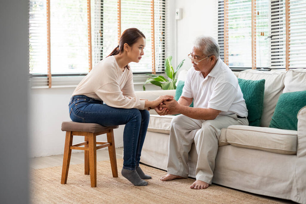 Caregiver psychologist console Asian senior people for mental health - Photo, image