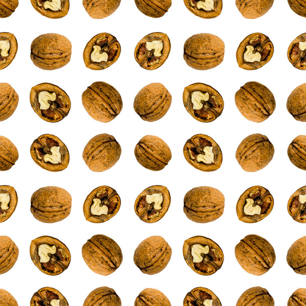 Walnuts seamless pattern on white isolated background. - Photo, Image