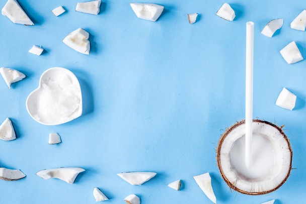 concept organic cosmetics with coconut on blue background top view - Φωτογραφία, εικόνα