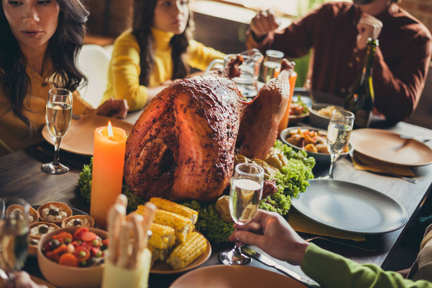Photo of served table thanks giving dinner garnished turkey family generation gathering blessing house living room indoors - Foto, Imagem