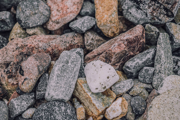 Small and big smooth round pebbles, sea dry stones, multicolour gray gravel. Abstract Composition Textured background. Ideal for web banner design - Photo, image