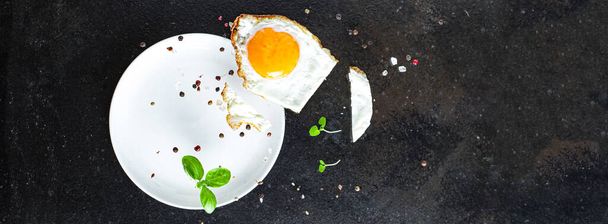 fried egg yolk and white fork for food omelette fresh dish and ingredients on the table tasty serving size portion top view copy space for text food background rustic - Zdjęcie, obraz