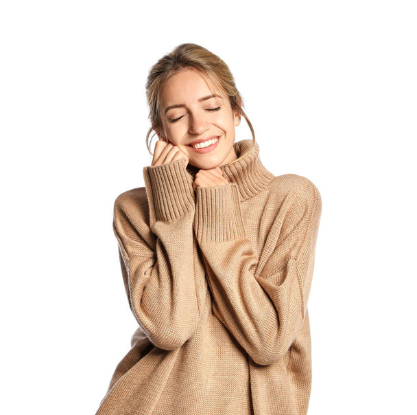 Beautiful young woman wearing knitted sweater on white background - Foto, Bild