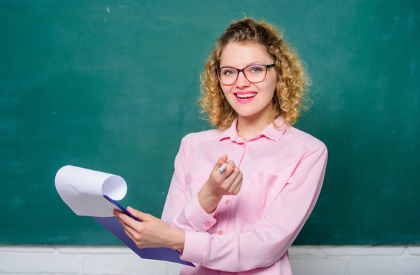 Confident student studying. girl teacher at lesson. new school year. Girl prepare for exams. teacher with document folder. report project. back to school. happy student in glasses at blackboard - Фото, зображення