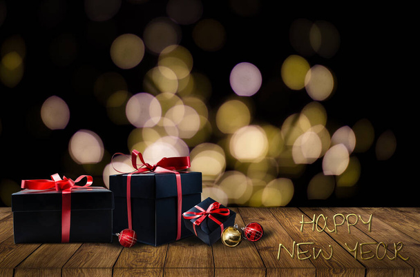 Christmas presents laid on a wooden table background - Foto, Imagem