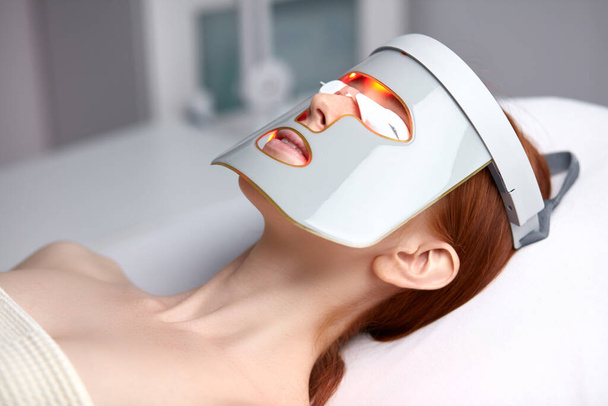 photodynamic face mask therapy for female in beauty salon - Photo, Image
