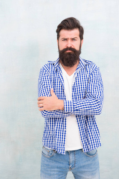 Bearded man with unshaven beard hair in casual fashion style keep arms crossed blue background, hipster - Photo, image