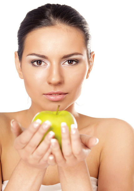 Young woman with a green apple - 写真・画像
