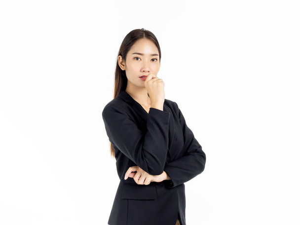 Portrait of serious young pretty Asian businesswoman in black suit looking camera isolated on white background. - Photo, Image