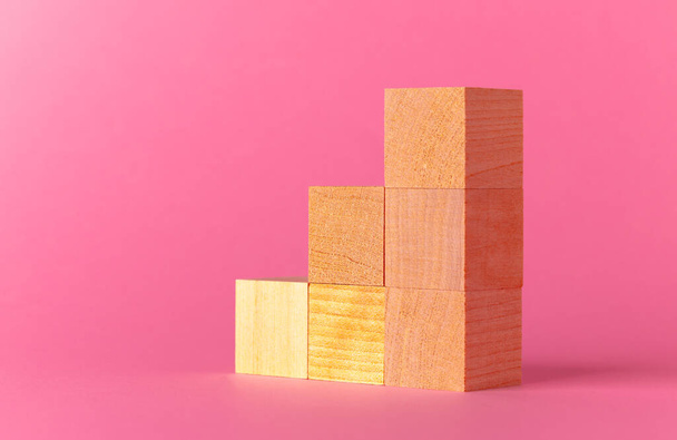 Toy wooden cubes with copy space against pink background - Foto, Imagem