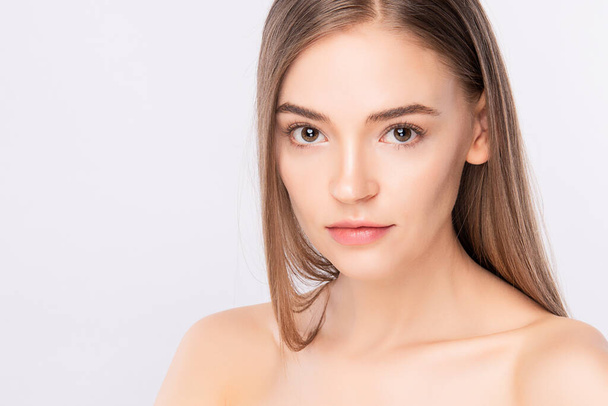 Beautiful Young Woman With Clean Fresh Skin on white background, Face care, Facial treatment. Cosmetology, beauty and spa. women portrait. - Foto, imagen