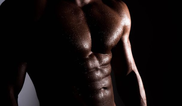Handsome muscular man with six pack abs. Mans torso. - 写真・画像