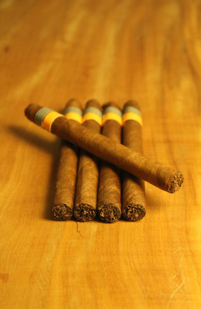 Closeup view of several cigars on wooden background  - Photo, Image