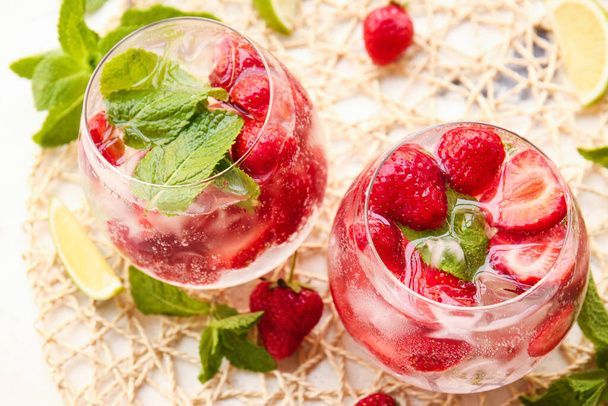 Glasses of fresh strawberry mojito on table - Photo, Image
