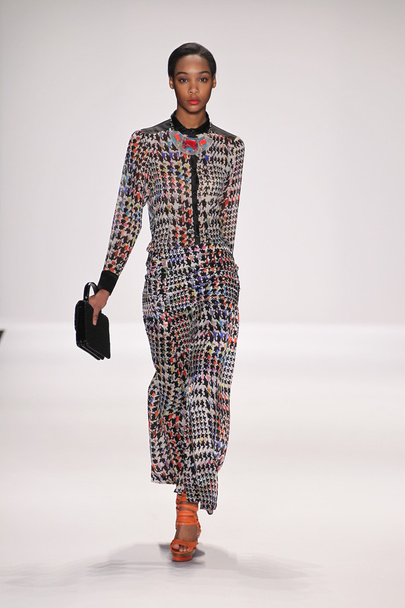 Model walks runway wearing Silkskin designer dress - Фото, изображение