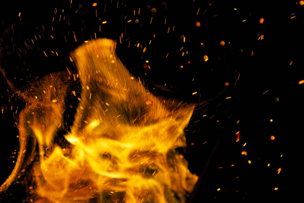 fire flames with sparks on a black background - 写真・画像