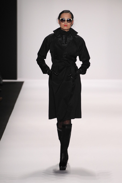 Model walks runway wearing Silkskin dress - Photo, Image