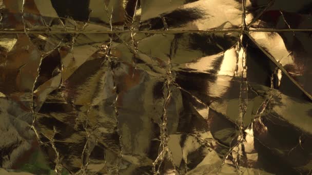 Wrinkled wrinkled yellow foil. Abstract vintage golden background - Footage, Video