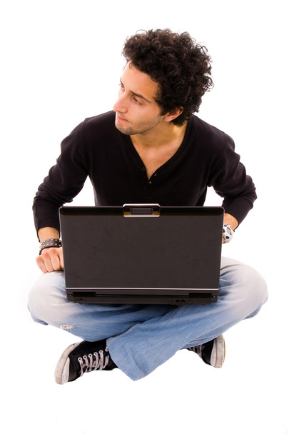 Man sitting on floor using laptop - Valokuva, kuva