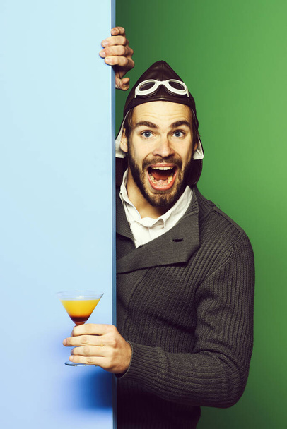 bearded pilot with cocktail in glass - Foto, imagen