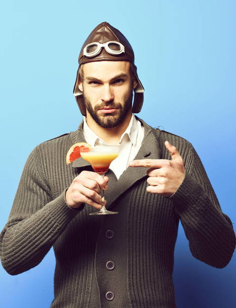 bearded pilot with cocktail in glass - Photo, Image