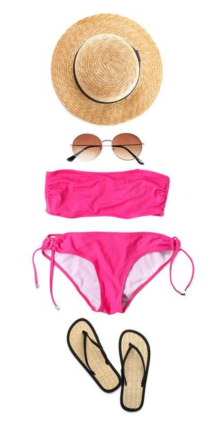 Set with swimsuit and summer accessories on white background, top view. Beach look  - Foto, Imagen