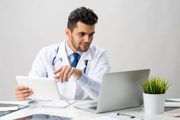 Young arab internist working with tablet computer - Photo, image