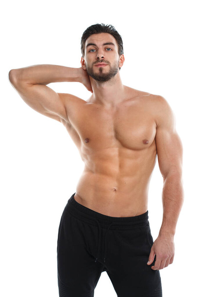 Cute athletic man with a naked torso isolated on white background. - Foto, imagen