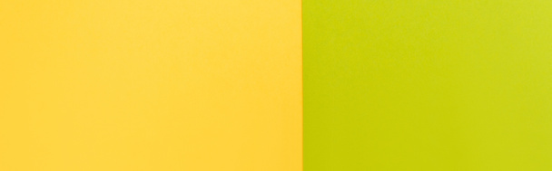 top view of colorful abstract yellow and green paper background, panoramic shot - Photo, Image