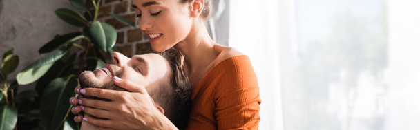 smiling woman touching face of happy boyfriend with closed eyes, banner - Foto, Imagem