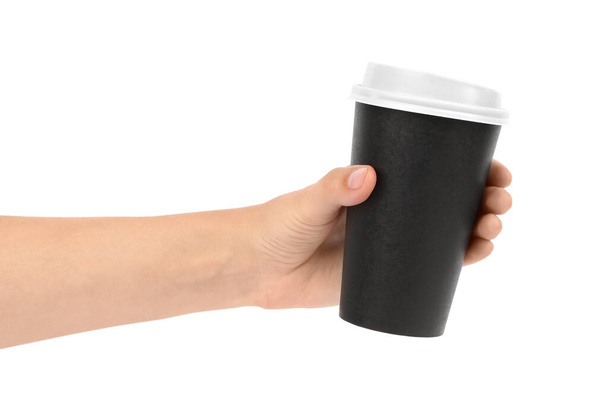 Woman holding takeaway paper coffee cup on white background, closeup - Foto, imagen