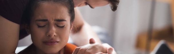 responsive man calming and hugging crying girlfriend, banner - Photo, Image