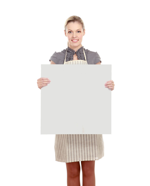 Woman in apron holding sign billboard - Zdjęcie, obraz