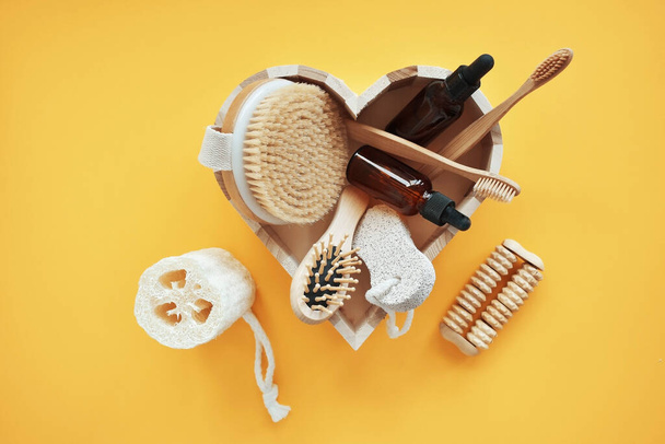 Zero waste. Bathroom accessories, natural brush, wooden comb, oil, makeup remover in a glass container, bamboo toothbrushes. Eco product concept. - Photo, Image