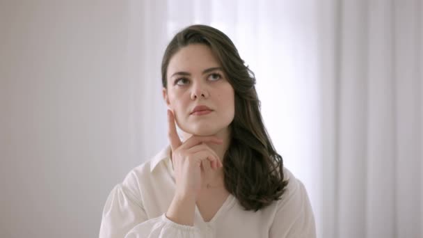 European woman thinking. Thoughtful expression. European pretty woman. - Footage, Video