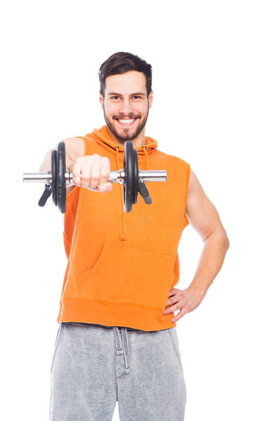 smiling man lifting dumbbell - Zdjęcie, obraz