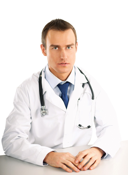 Doctor sitting at the desk - Фото, зображення