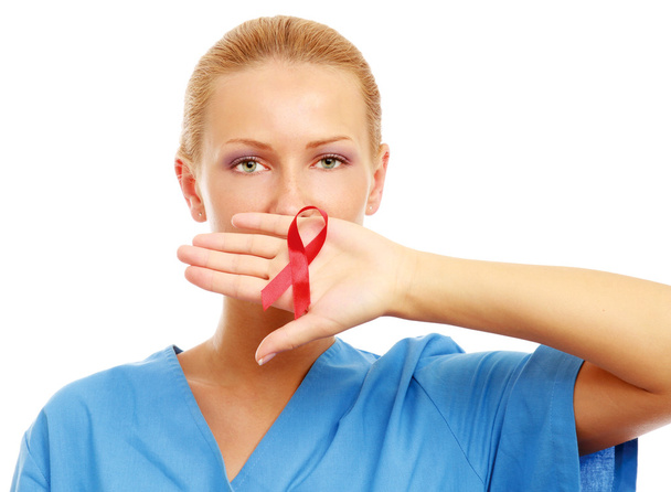 Female doctor with aids ribbon - Фото, изображение