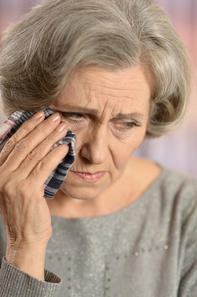 Old woman crying - Фото, изображение