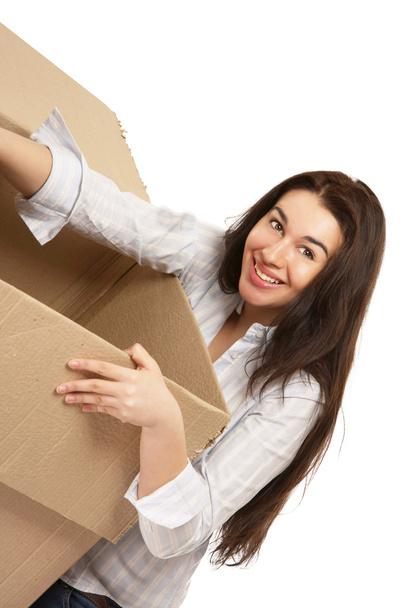 Young woman carrying a box - Photo, Image