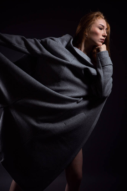 high fashion portrait of a sexy woman in a coat - Fotografie, Obrázek