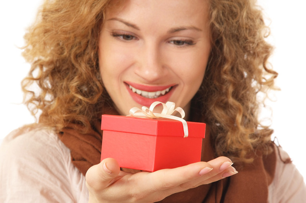 Woman is holding a gift - Zdjęcie, obraz